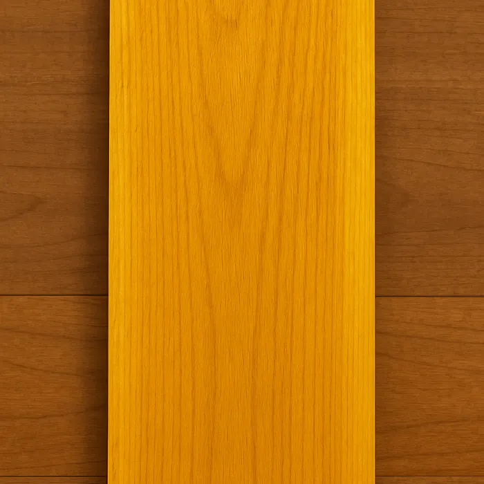 Osage Orange hardwood lumber board with a rich golden-yellow tone and fine grain detail.