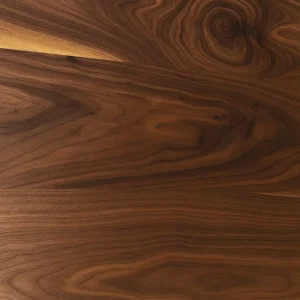 Close-up of black walnut lumber showing rich brown grain with swirling figure and darker streaks.