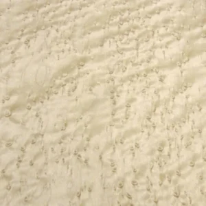 Close-up of Birdseye Maple figure—cream-colored hard maple with small “birdseye” curls across the surface.