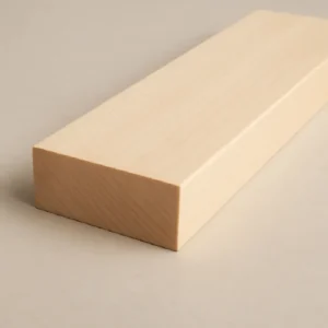 Close-up of a light maple hardwood board with straight grain on a neutral background at G&H Hardwoods in Auburn, WA