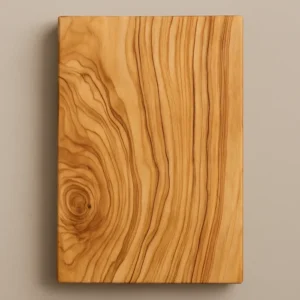 Olivewood hardwood board showing golden grain and swirling figure on a neutral background