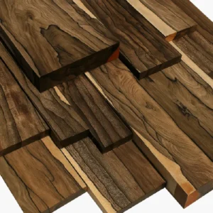 Stack of dark brown ziricote hardwood boards with dramatic black streaks and sapwood edges